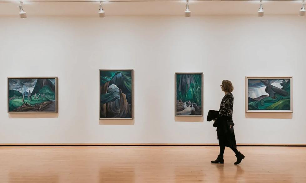 Loans against Artwork with lamna. Lady walking through art gallery